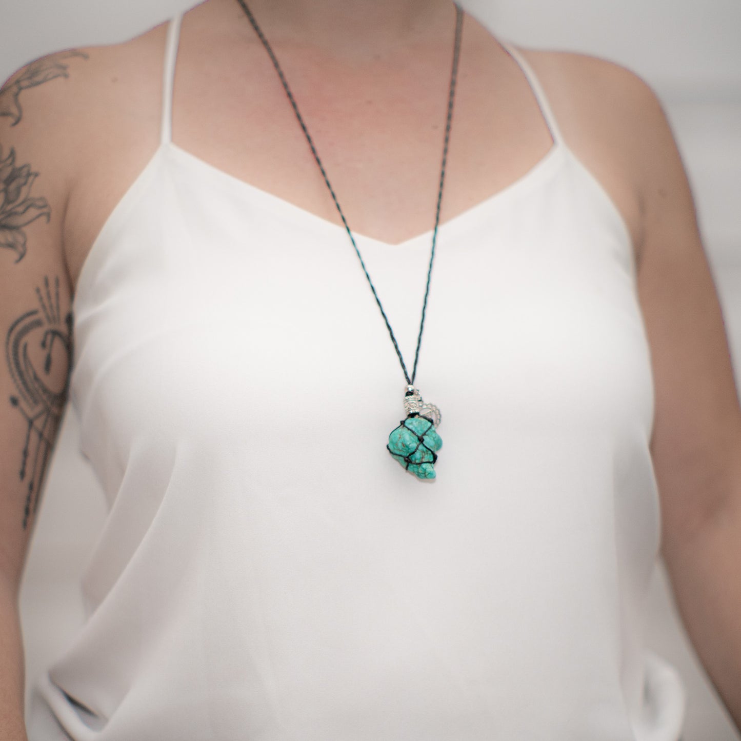 Adjustable black necklace with Turquoise Stone.