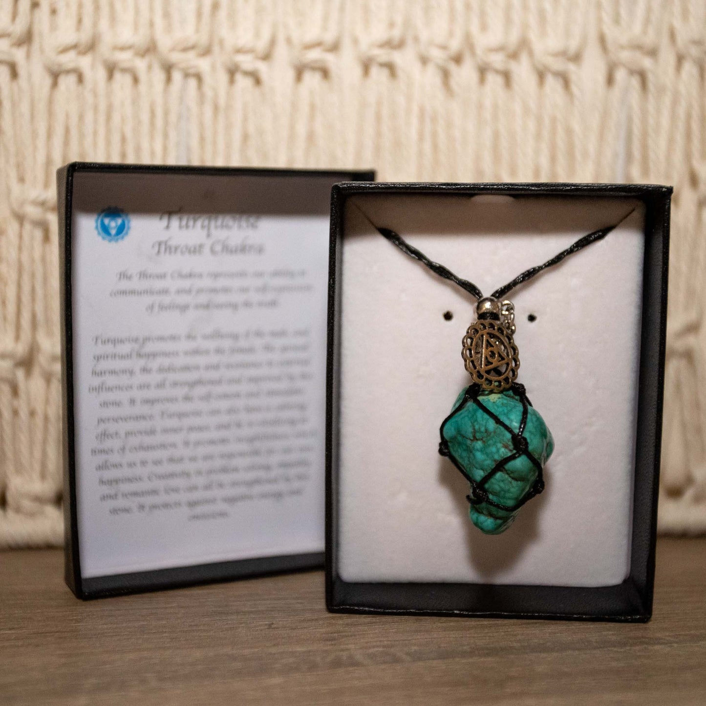 Adjustable black necklace with Turquoise Stone.