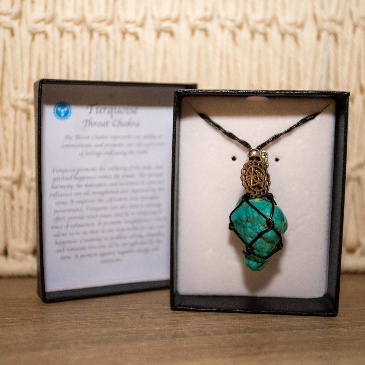 Adjustable black necklace with Turquoise Stone.