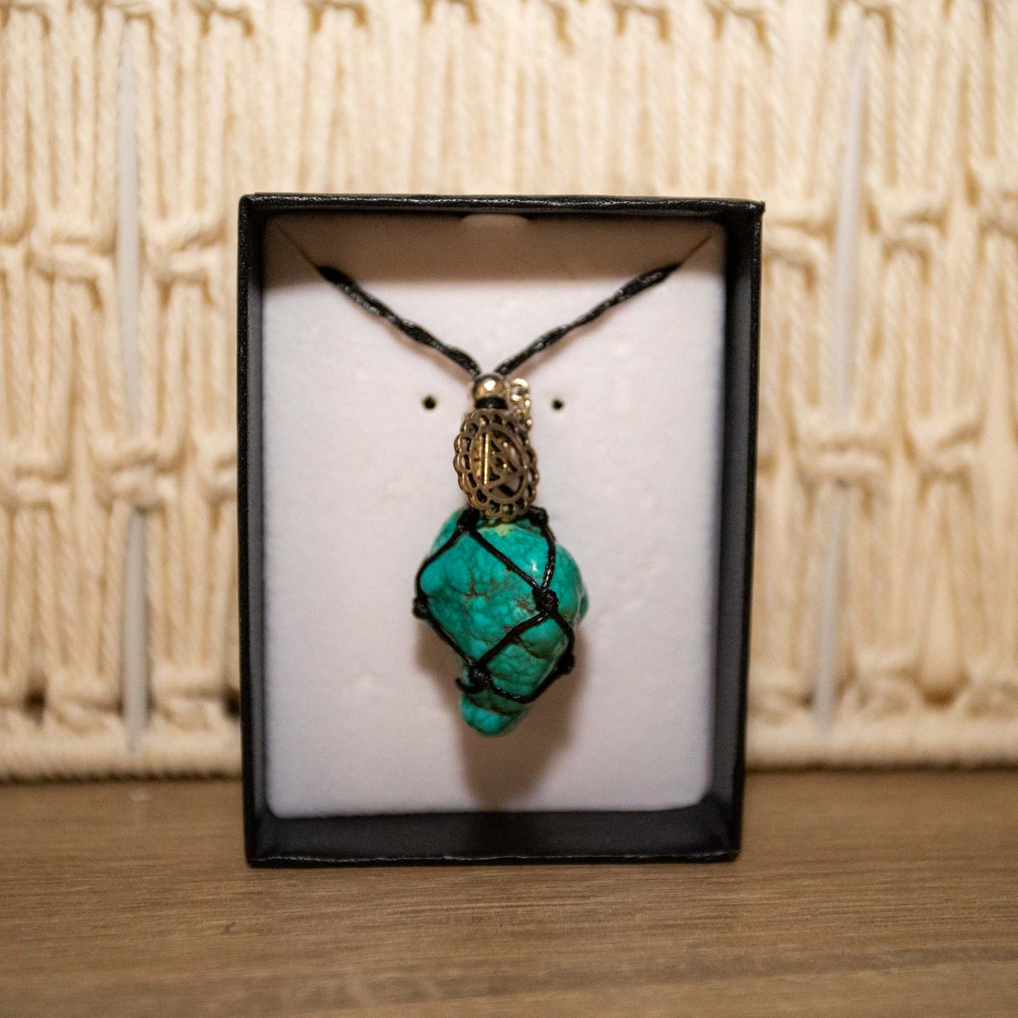 Adjustable black necklace with Turquoise Stone.