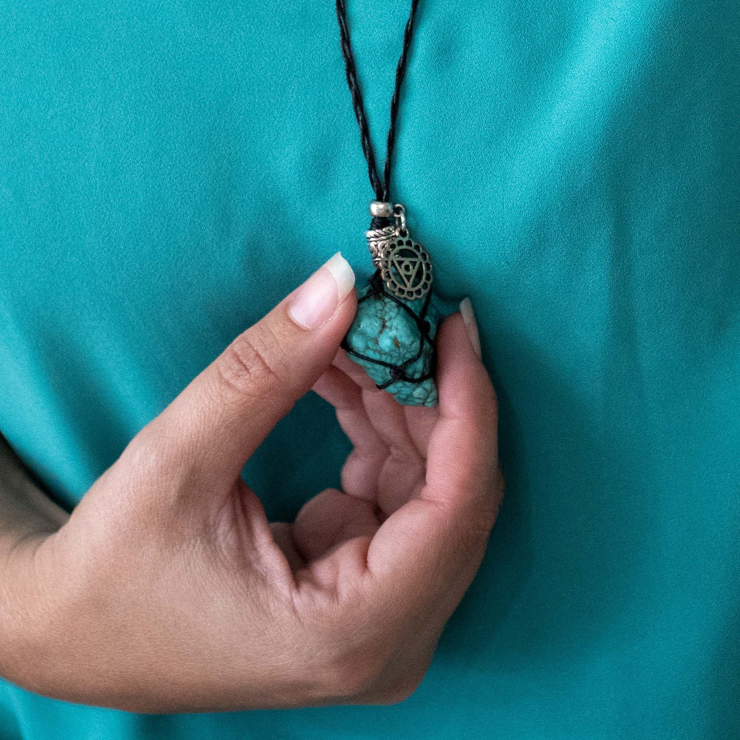 Adjustable black necklace with Turquoise Stone.